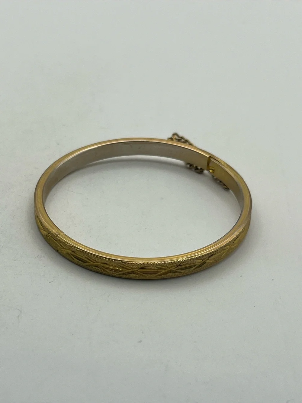 Etched design gold tone small child sized bangle bracelet vintage